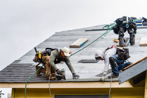 Professional Roof Replacement technician working in Cove, OR